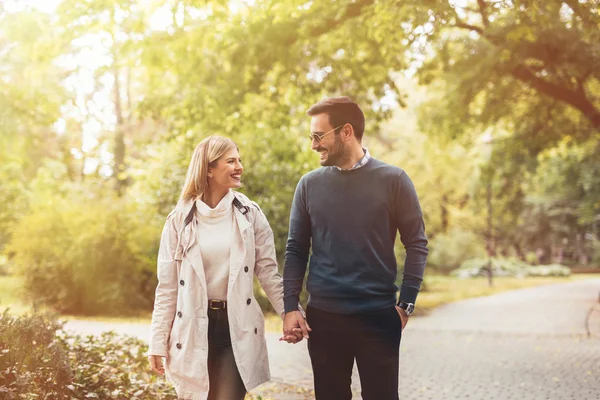 depositphotos_127967782-stock-photo-happy-couple-walking-in-park