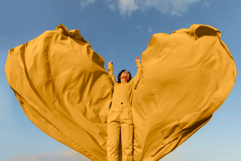 freedom-concept-with-woman-holding-cloth-nature