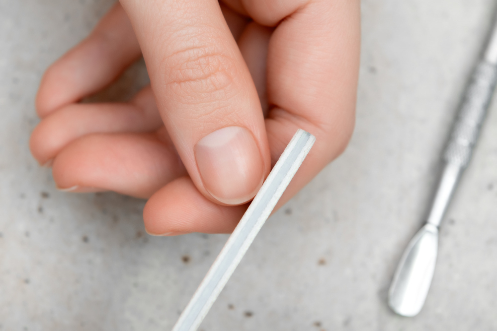 girl-doing-manicure-by-herself-close-up