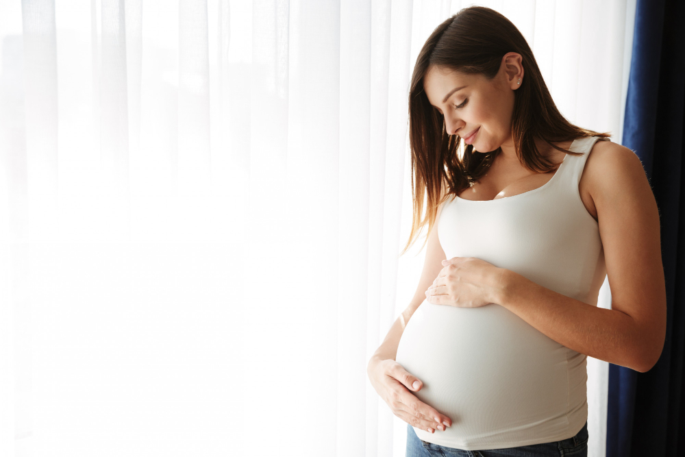 portrait-happy-pregnant-woman-touching-her-belly