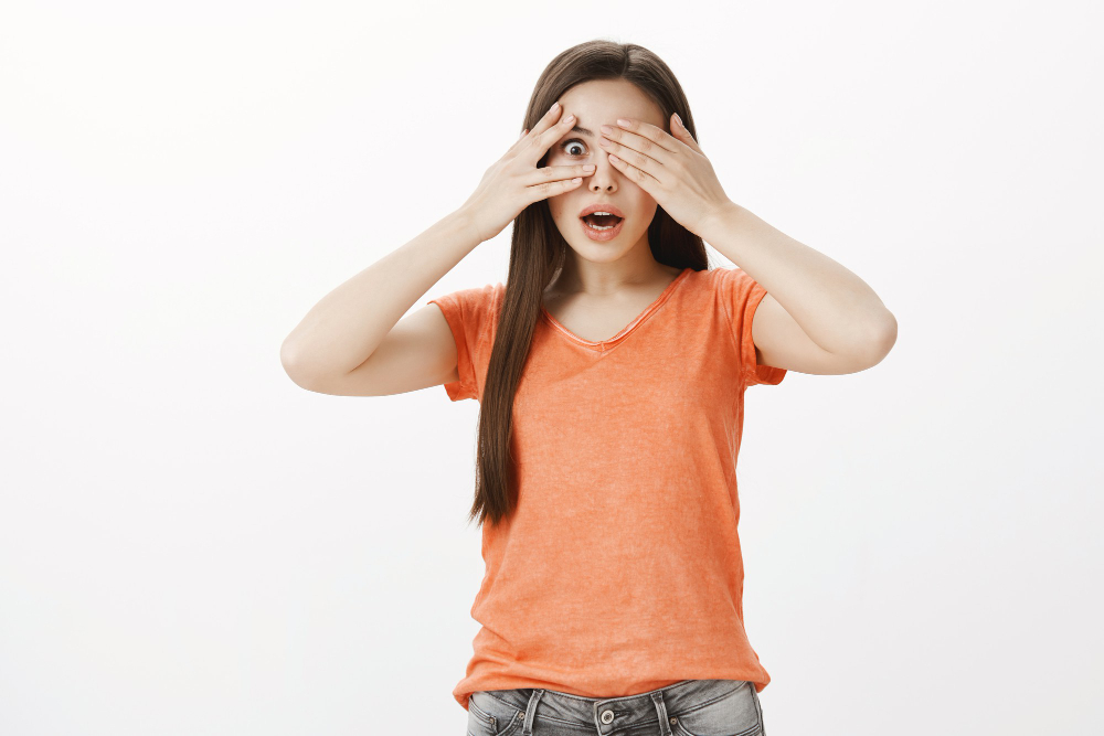 dreamy-hopeful-smiling-woman-close-eyes-peeking-through-fingers-impressed