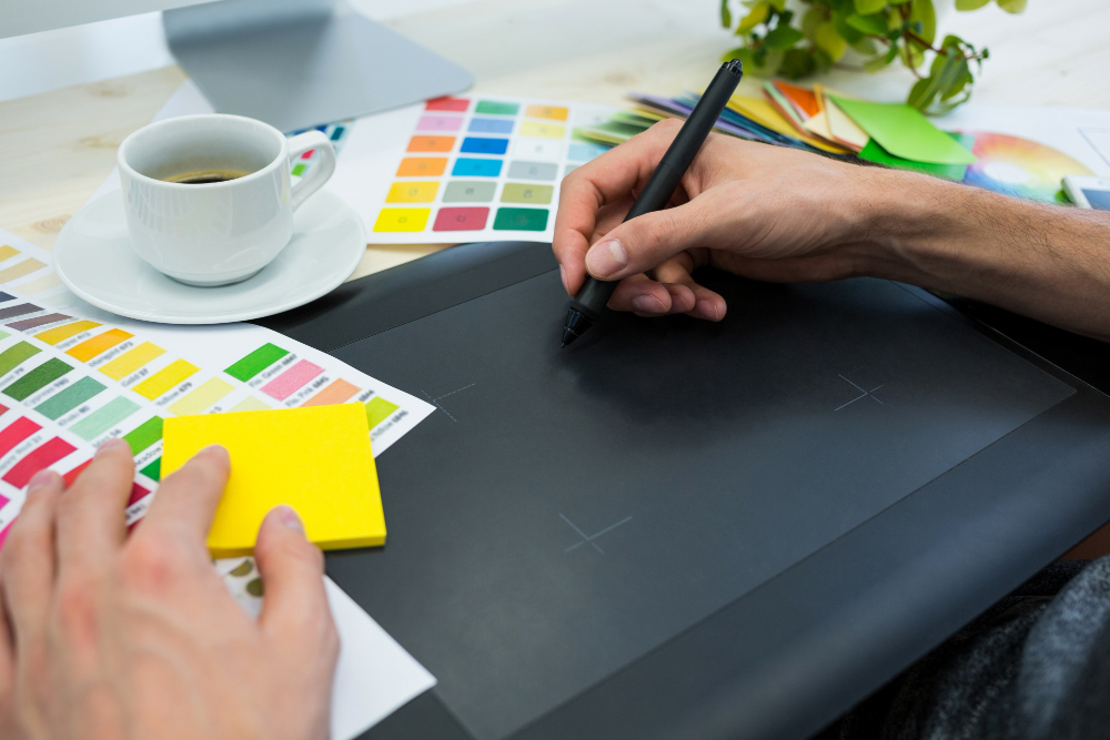 hands-male-graphic-designer-using-graphics-tablet