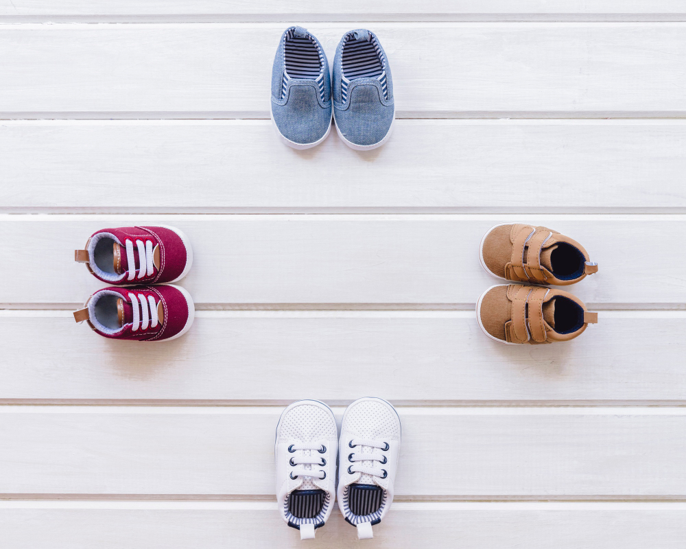 newborn-concept-with-four-pairs-shoes